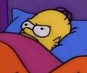 Homer Simpson in bed glaring