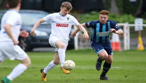 Picture of me playing football for ucd example of trying new thing in UCD