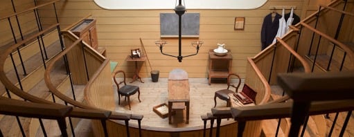 View of the Old Operating Theatre showing the operating table, seating gallery and some operating tools from the 1800s