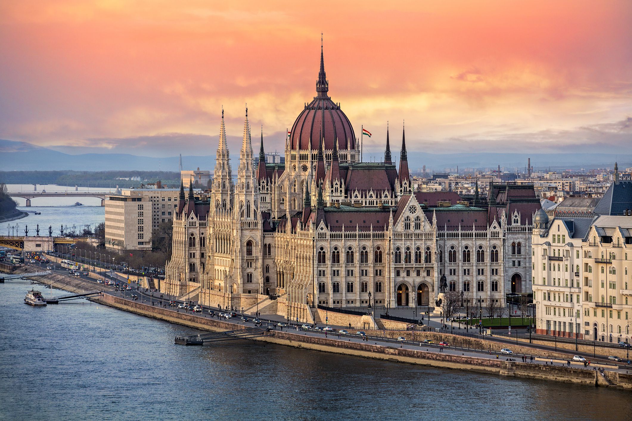 the-hungarian-parliament-on-the-danube-river-at-sunset-in-budapest--hungary-945207010-23afbc9012d54bc4bb7c8a1f8c90075b-1